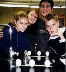 Mancelona students standing up eggs